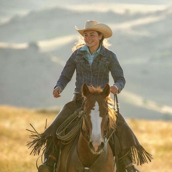 swan-valley-idaho-fishing-summer-activities-horseback-riding Women Riding Horse