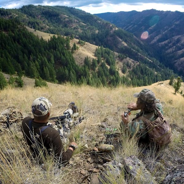 swan-valley-idaho-fishing-summer-activities-hunting Two people with gun